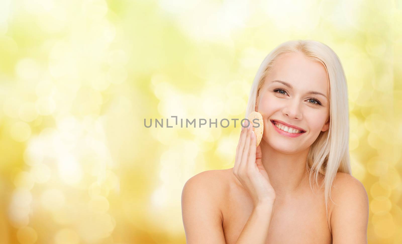 health, beauty and spa concept - beautiful woman with sponge