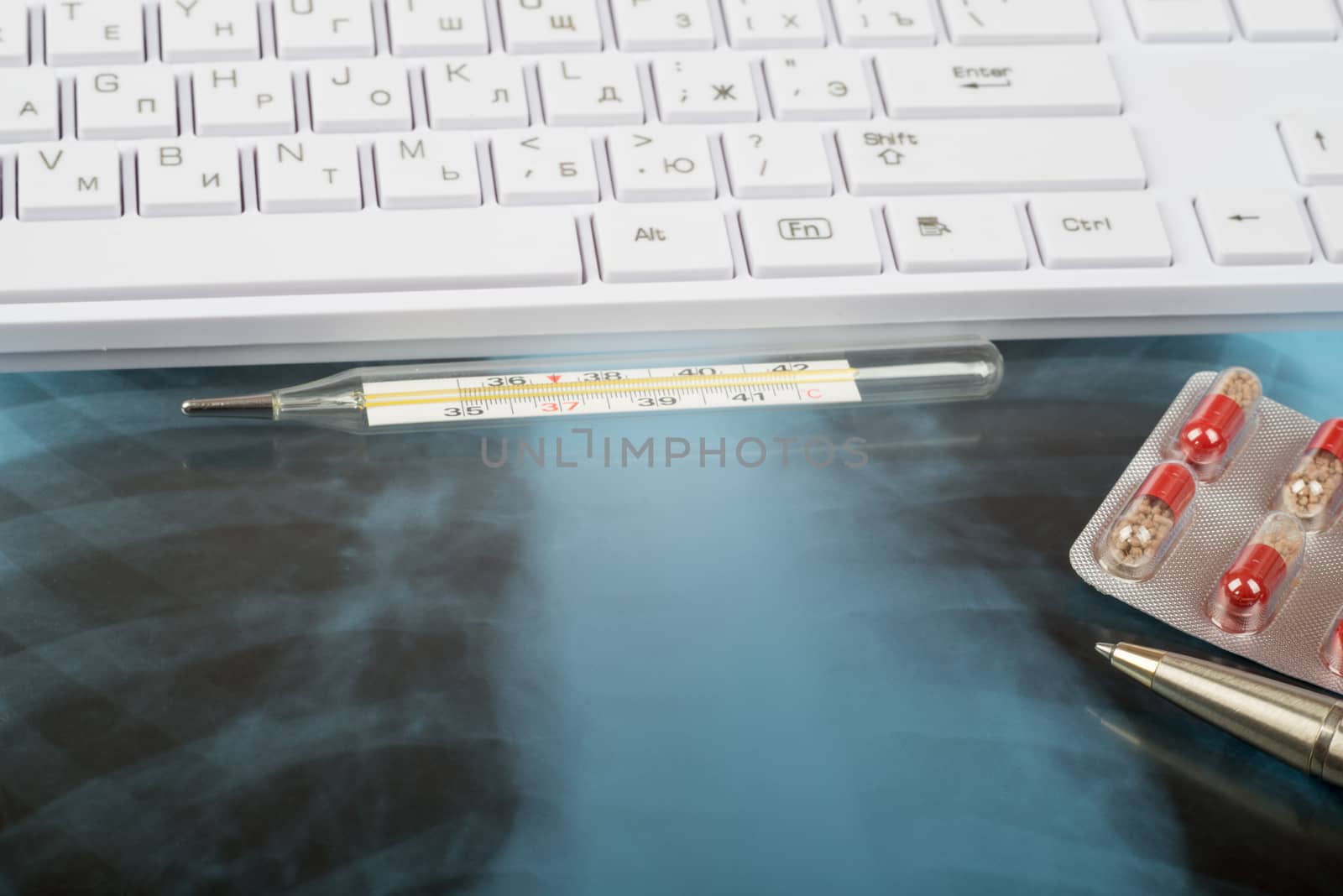 X-ray examination and keyboard with thermometer, drugs