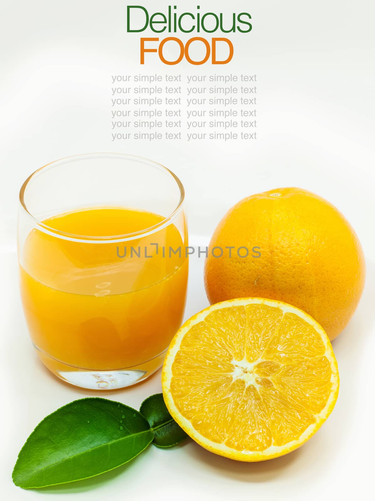 Glass of fresh orange juice with sliced orange .