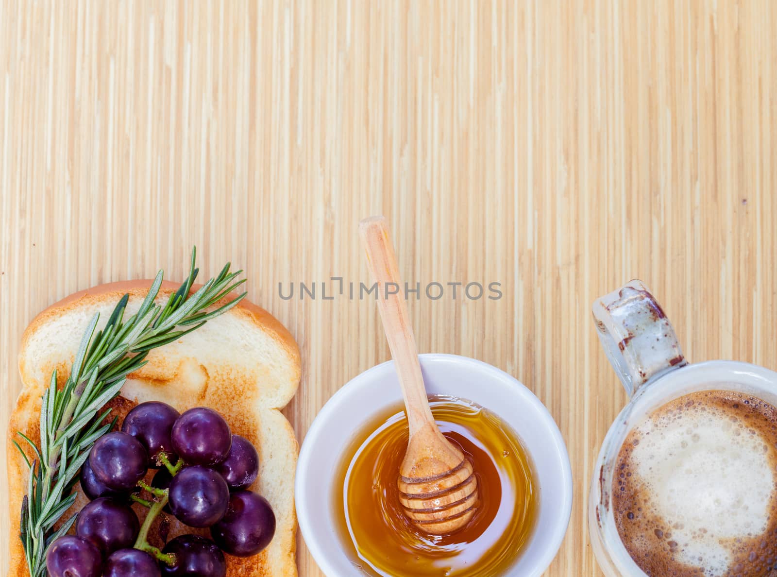 Healthy breakfast with  toasts and herb on wooden table with copy space.