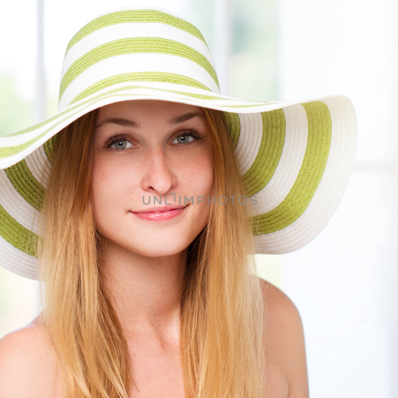 Portrait of pretty woman wearing straw hat in sunny . square crop