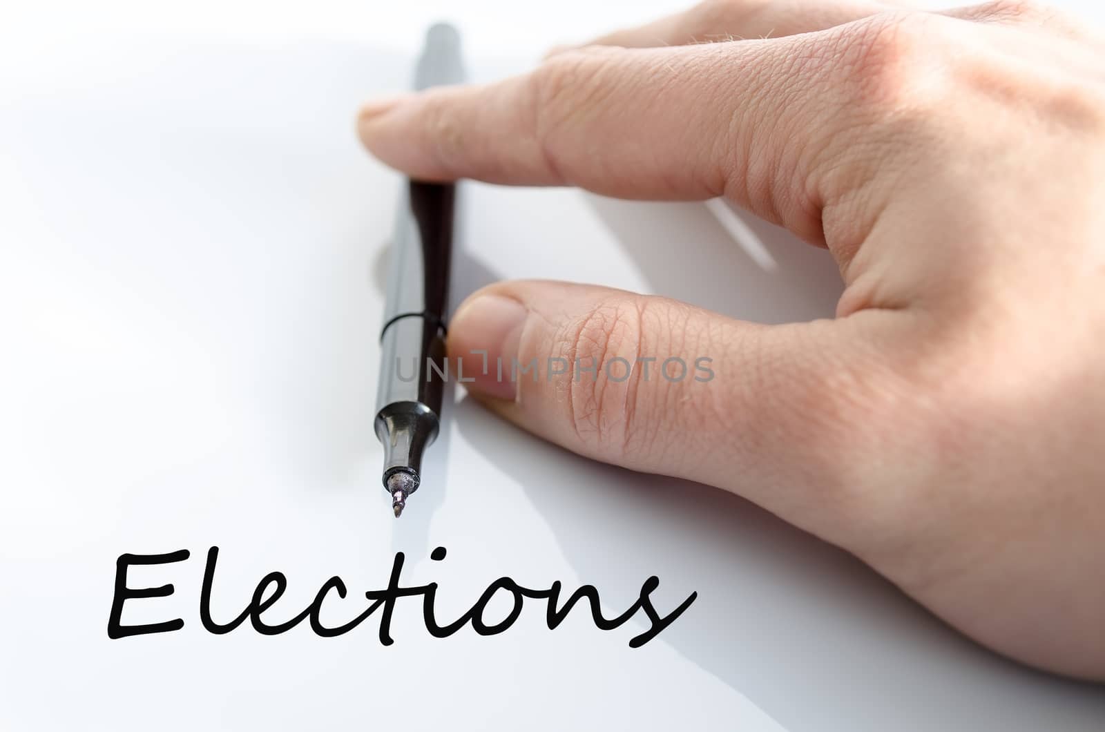 Pen in the hand isolated over white background and text concept
