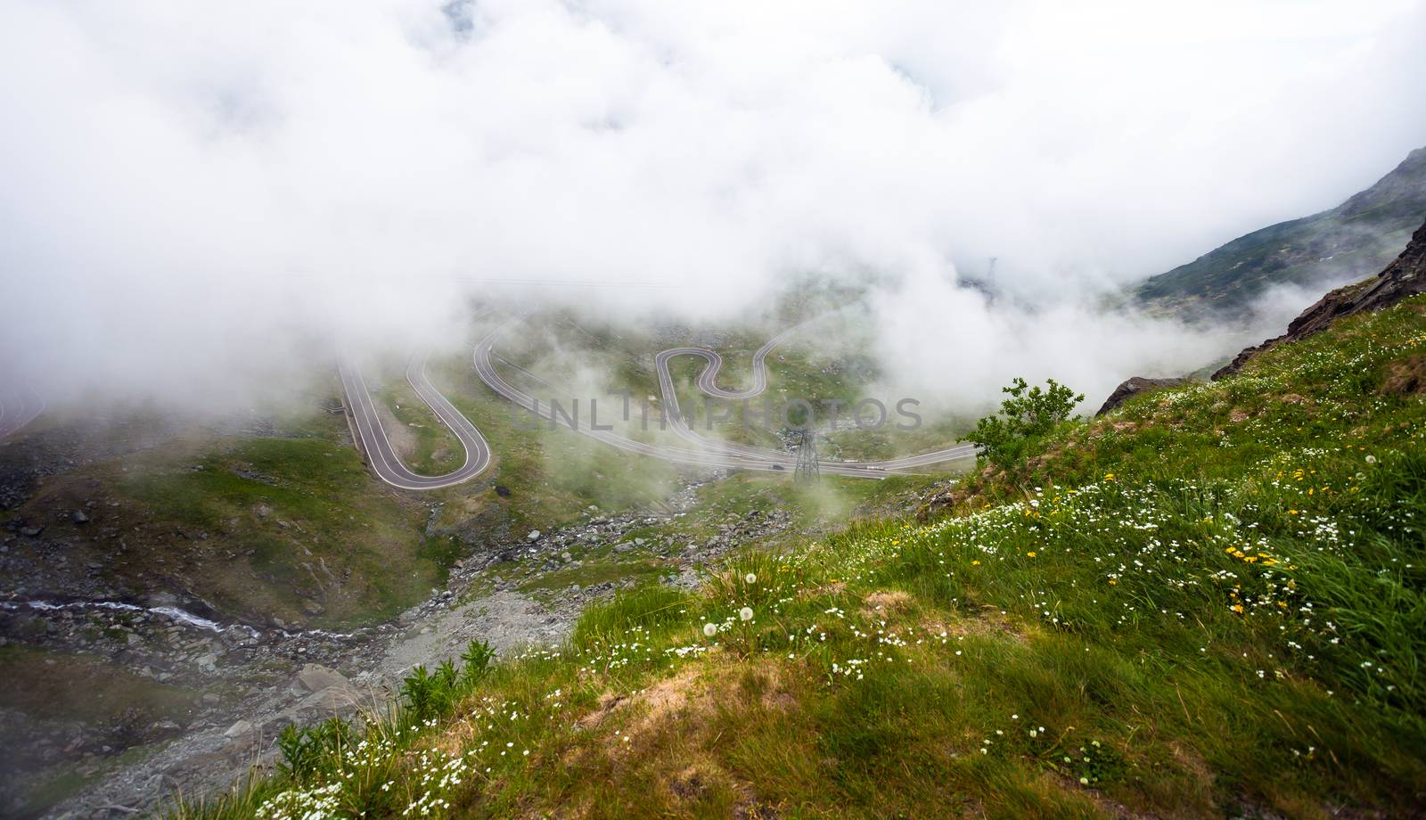 Transfagarasan mountain road from Romania covered with fog