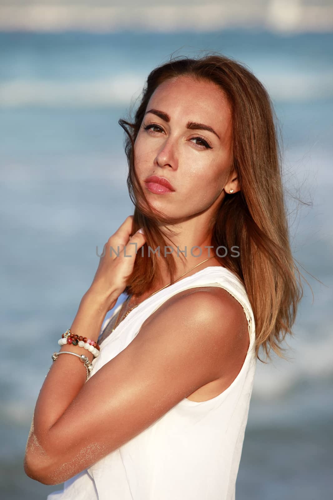 The beautiful girl on coastline ocean