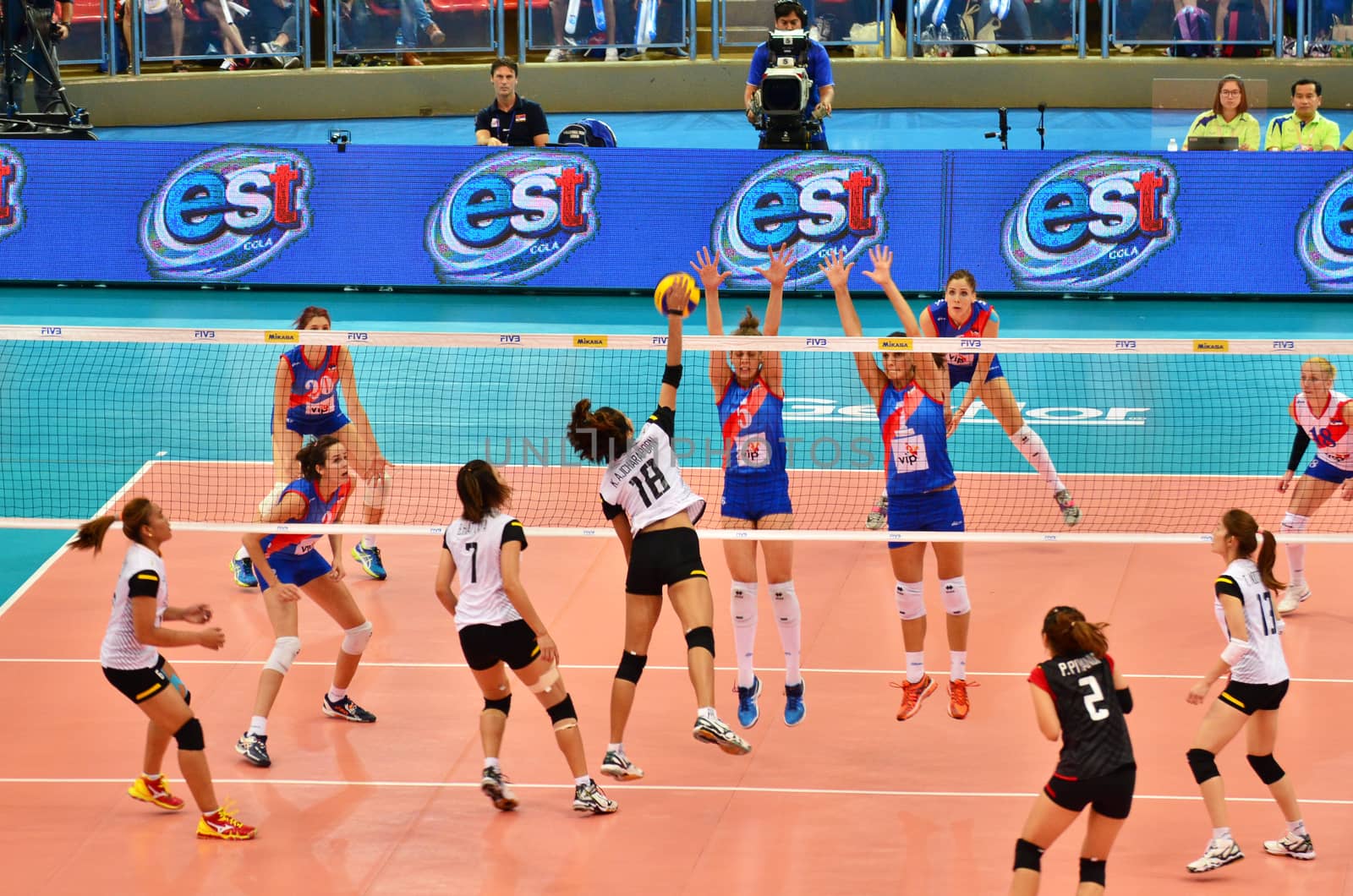 Bangkok, Thailand - July 3, 2015: Ajcharaporn Kongyot#18 of Thailand spikes over Serbs block during the FIVB Volleyball World Grand Prix by siraanamwong