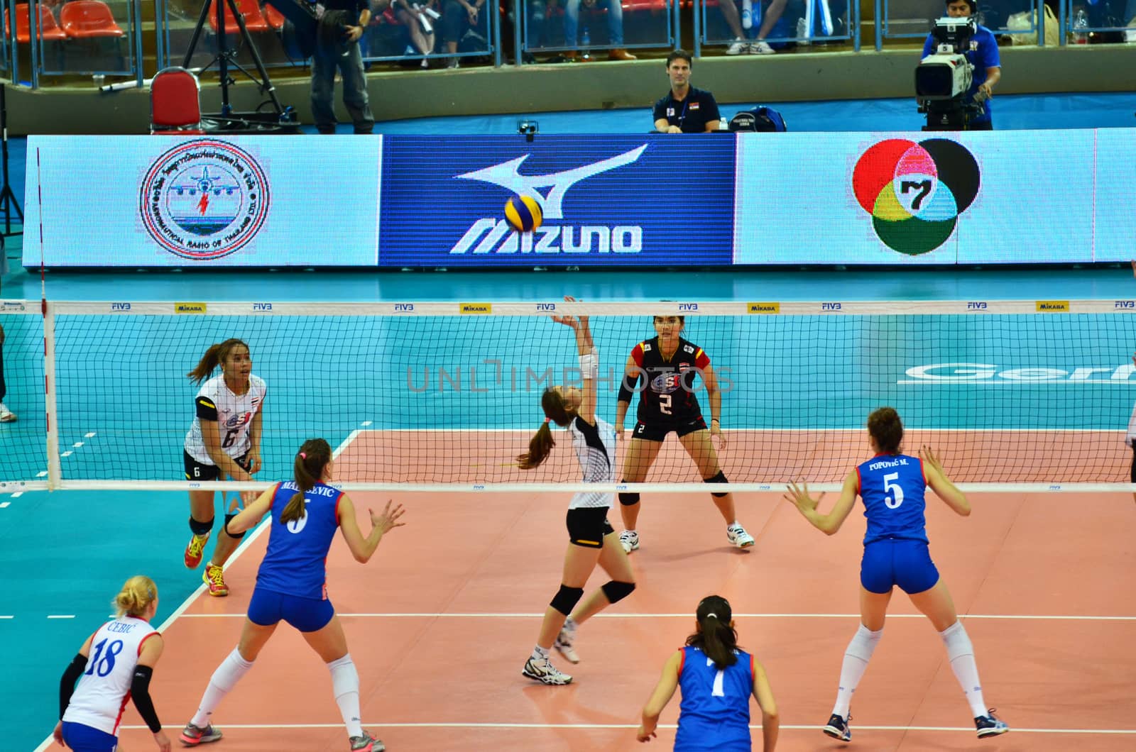 Bangkok, Thailand - July 3, 2015: Nootsara Tomkom #13 of Thailand setting up the ball during the FIVB Volleyball World Grand Prix by siraanamwong