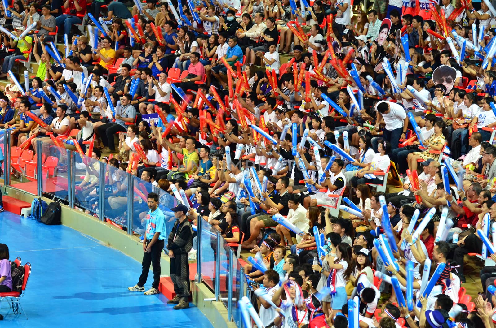 Bangkok, Thailand - July 3, 2015: Thai supporters celebrates a Thailand point at Indoor Stadium Huamark during the FIVB Volleyball World Grand Prix Thailand and Serbia on July 3, 2015 in Bangkok, Thailand.