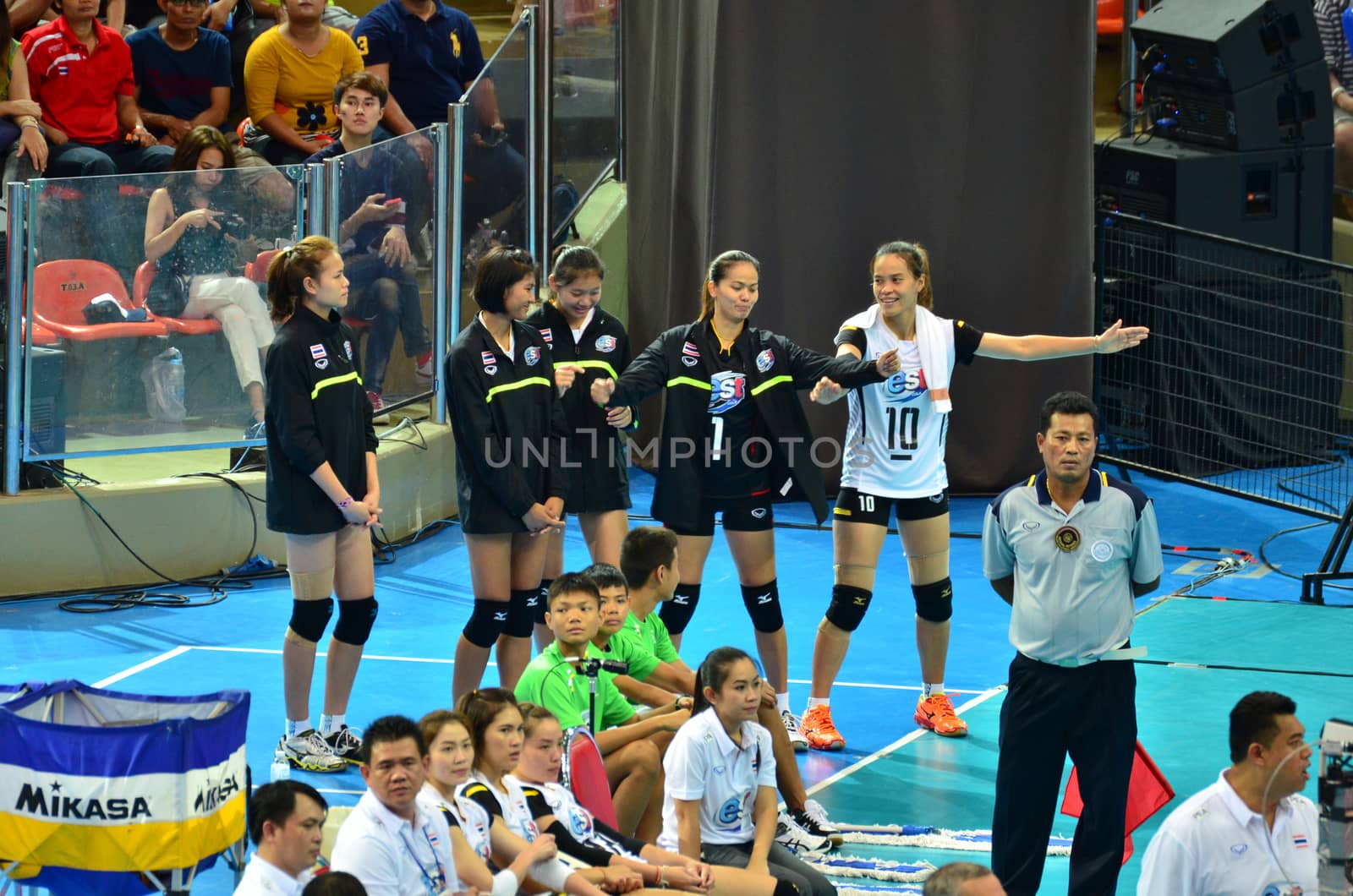 Bangkok, Thailand - July 3, 2015: Thailand substitution celebrates during the FIVB Volleyball World Grand Prix Thailand and Serbia at Indoor Stadium Huamark on July 3, 2015 in Bangkok, Thailand.