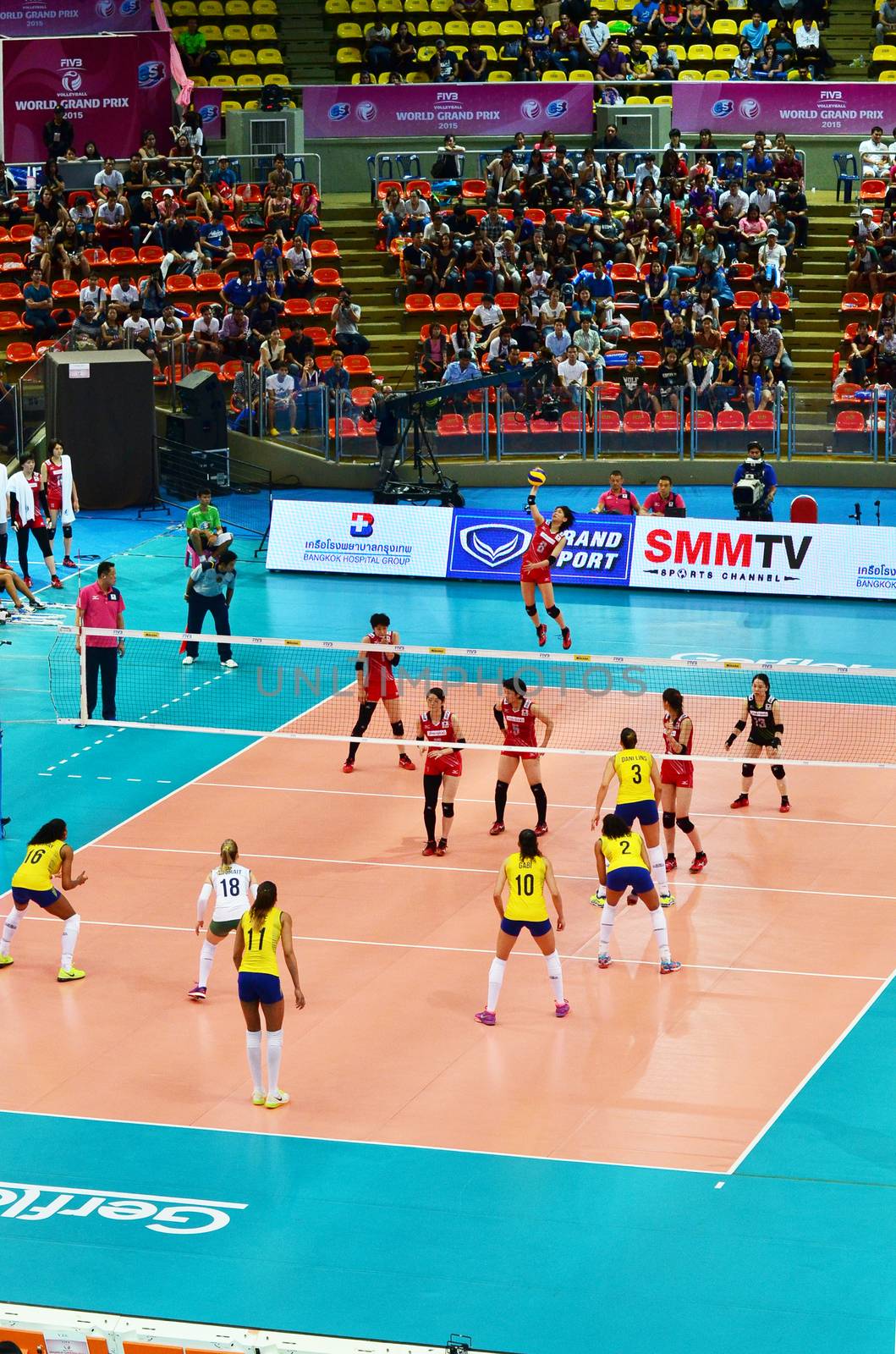 Bangkok, Thailand - July 3, 2015: Japanese player serves the ball during the FIVB Volleyball World Grand Prix by siraanamwong