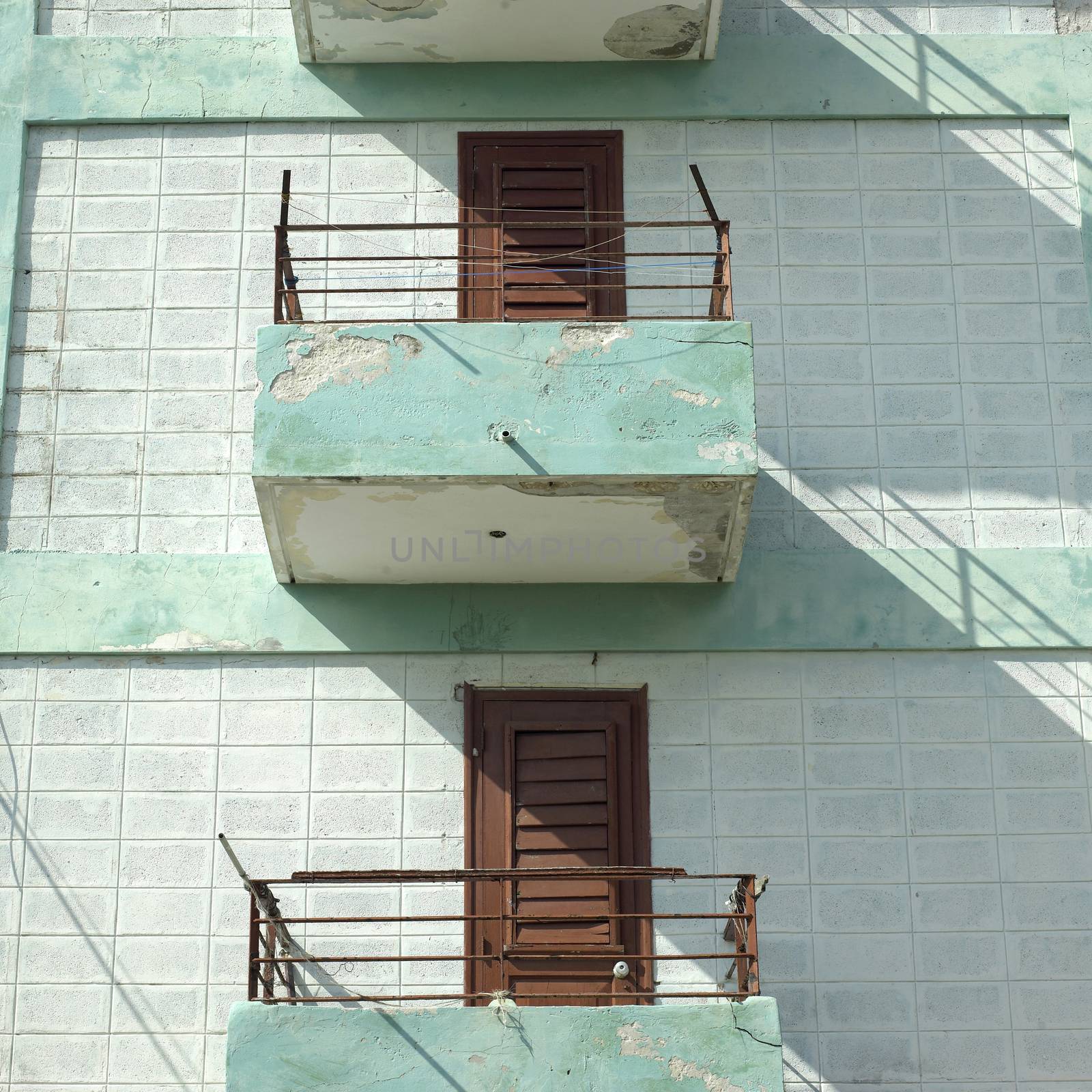 Modest balconies and railings of a low income apartment building 