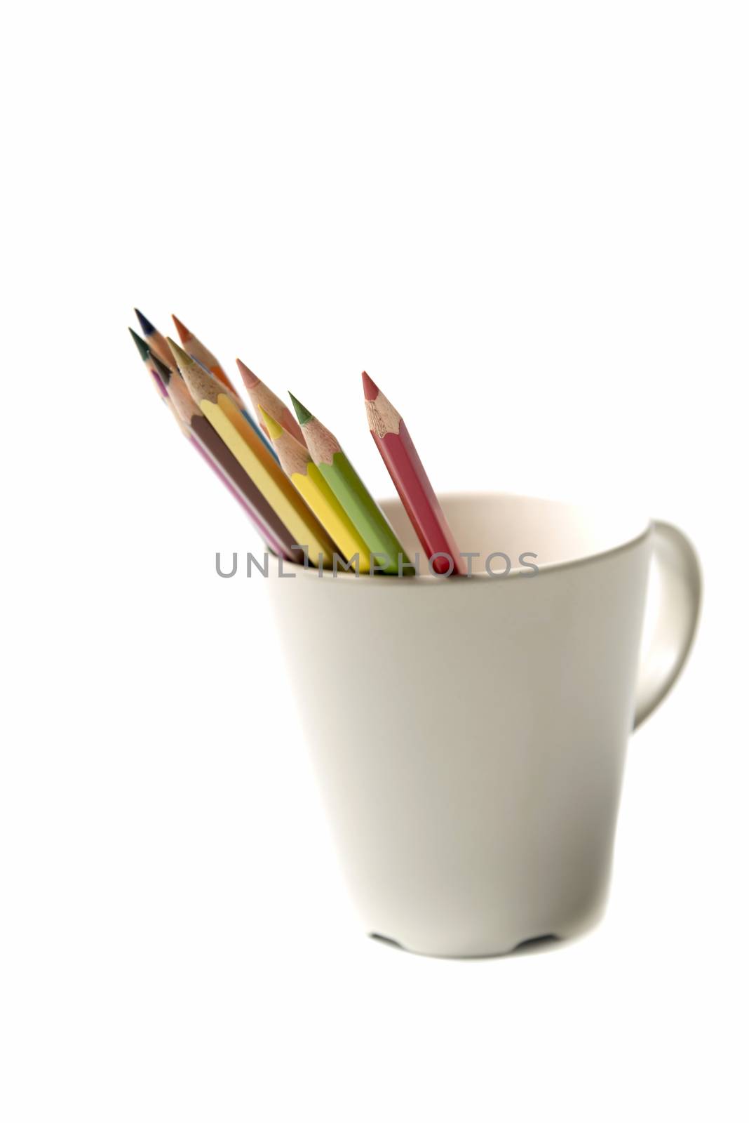 colorful pencil in mug isolated on white background