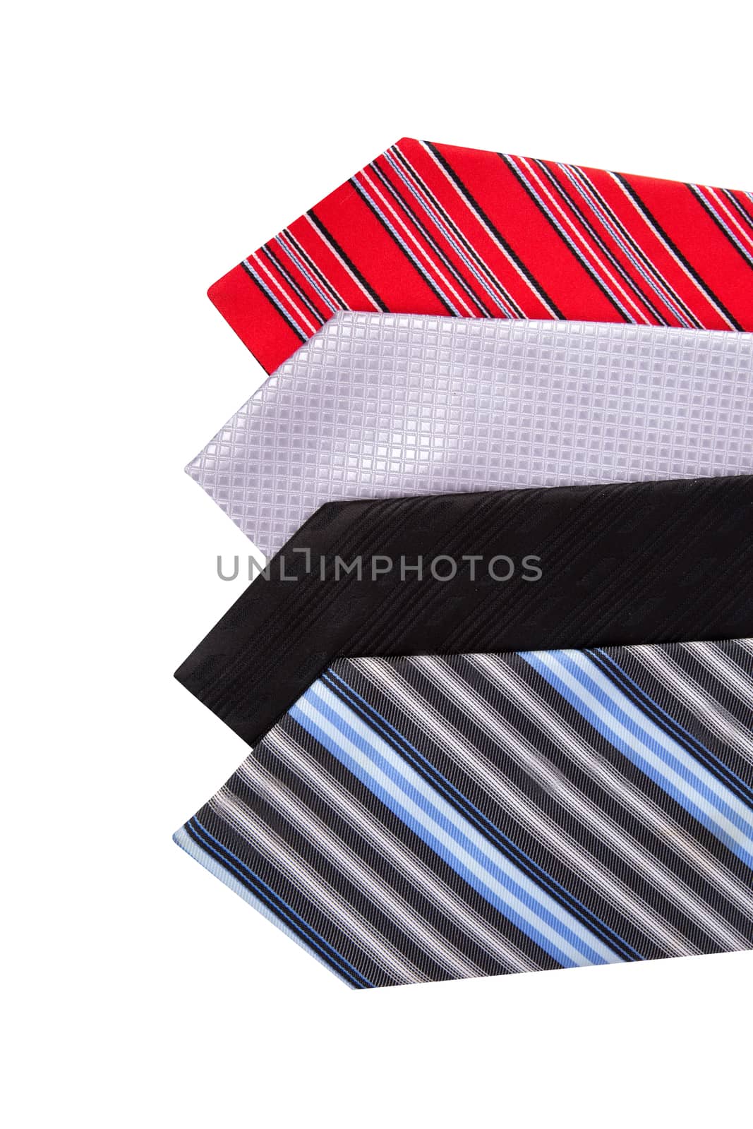 Close up top view of colorful men ties side by side, isolated on white background.