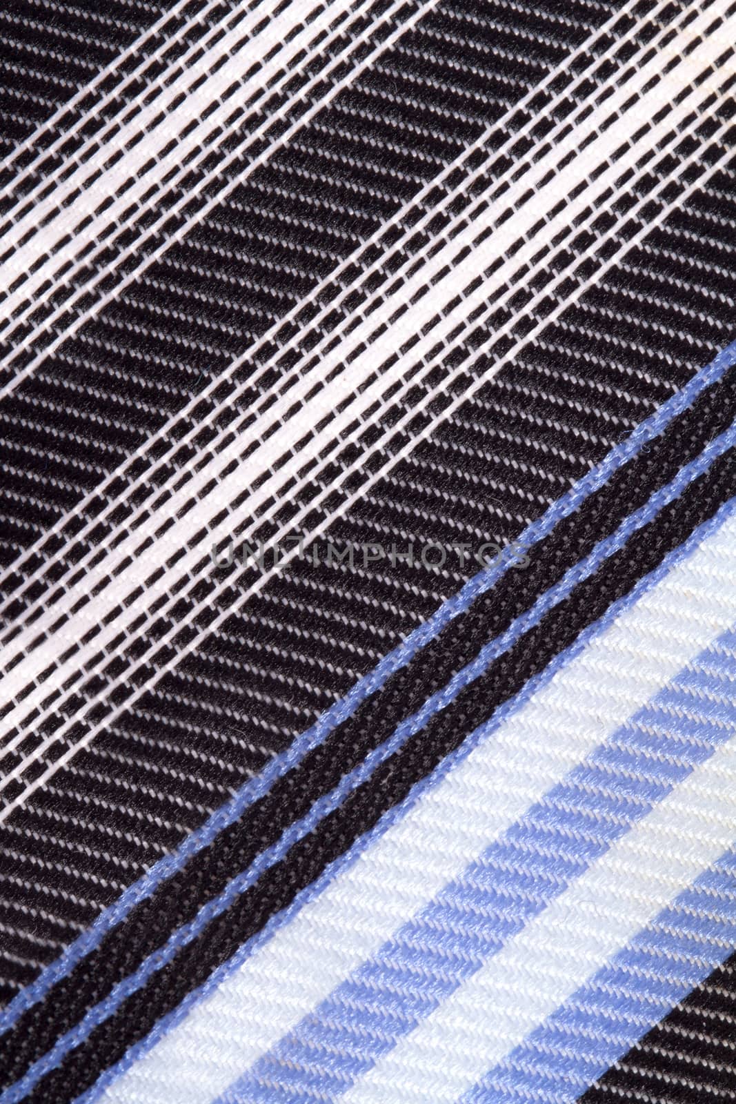 Close up detailed view of colorful striped fabric as background.