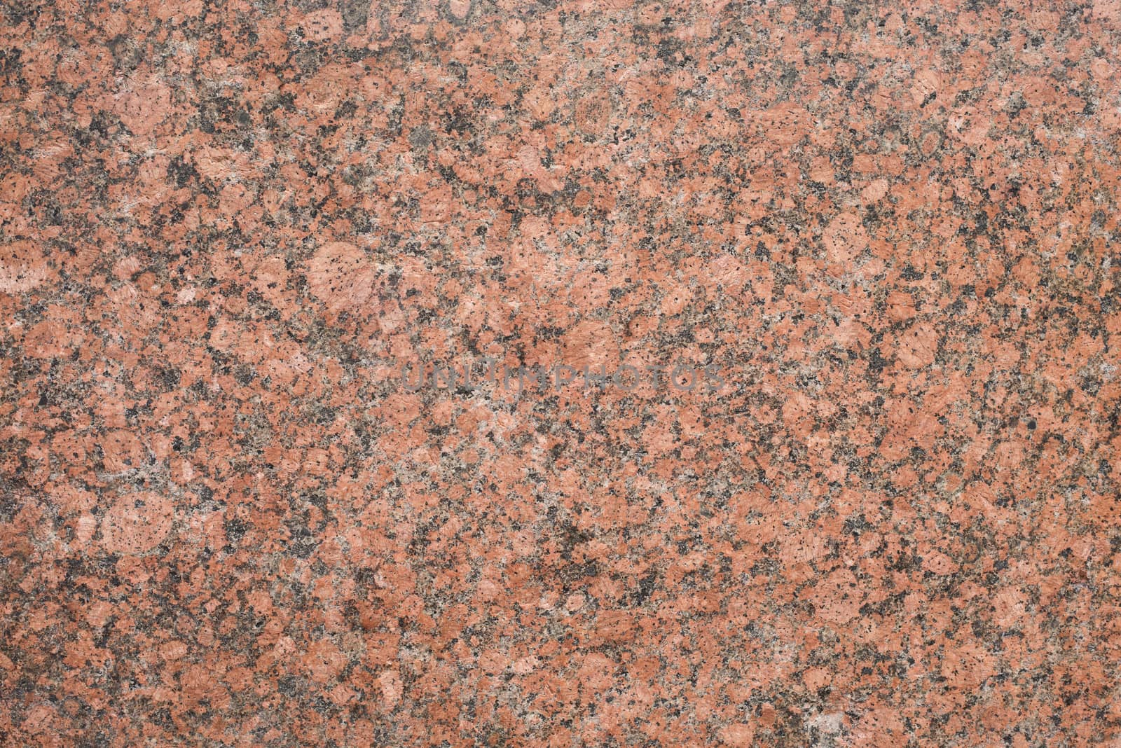 Brown granite stone wall. Nature texture background