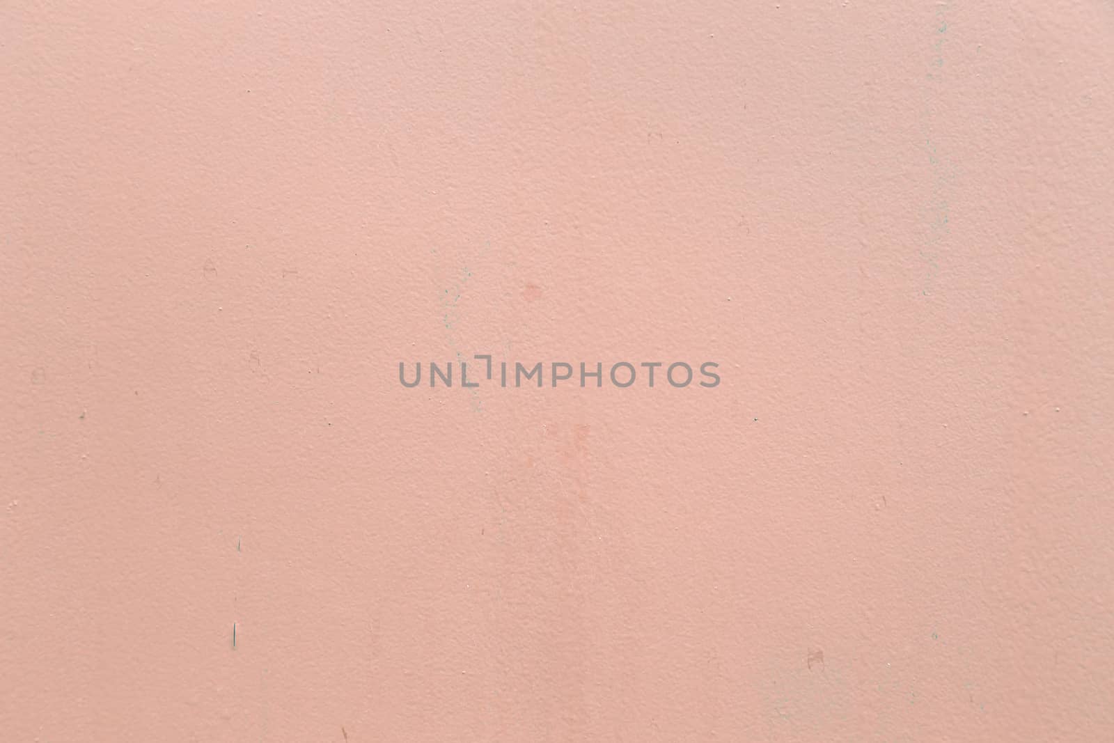 A grained pinkish concrete wall with texture, some spots but they are there in real life and create some life to this one