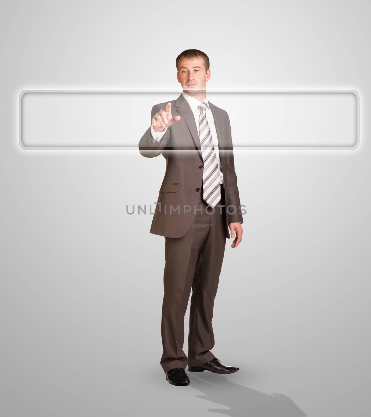 Businessman standing and pressing on holographic screen on abstract grey background, close-up view