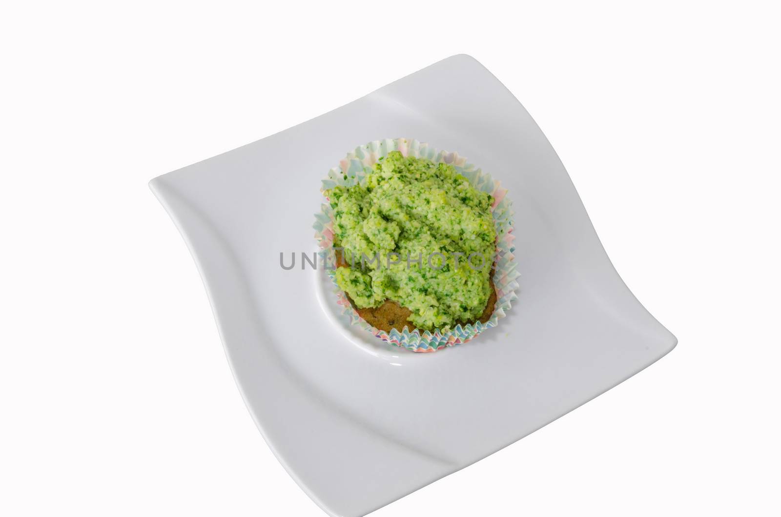 Muffin with fresh fruit and vanilla pod on a light background.