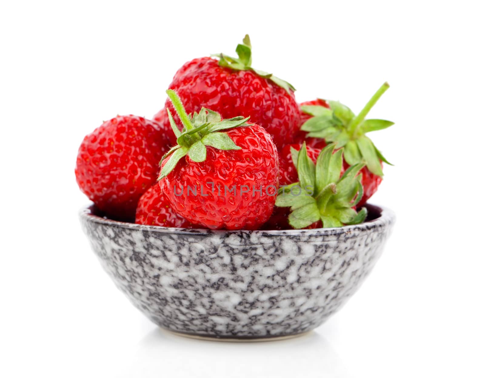 bowl with strawberries isolated on white background by motorolka