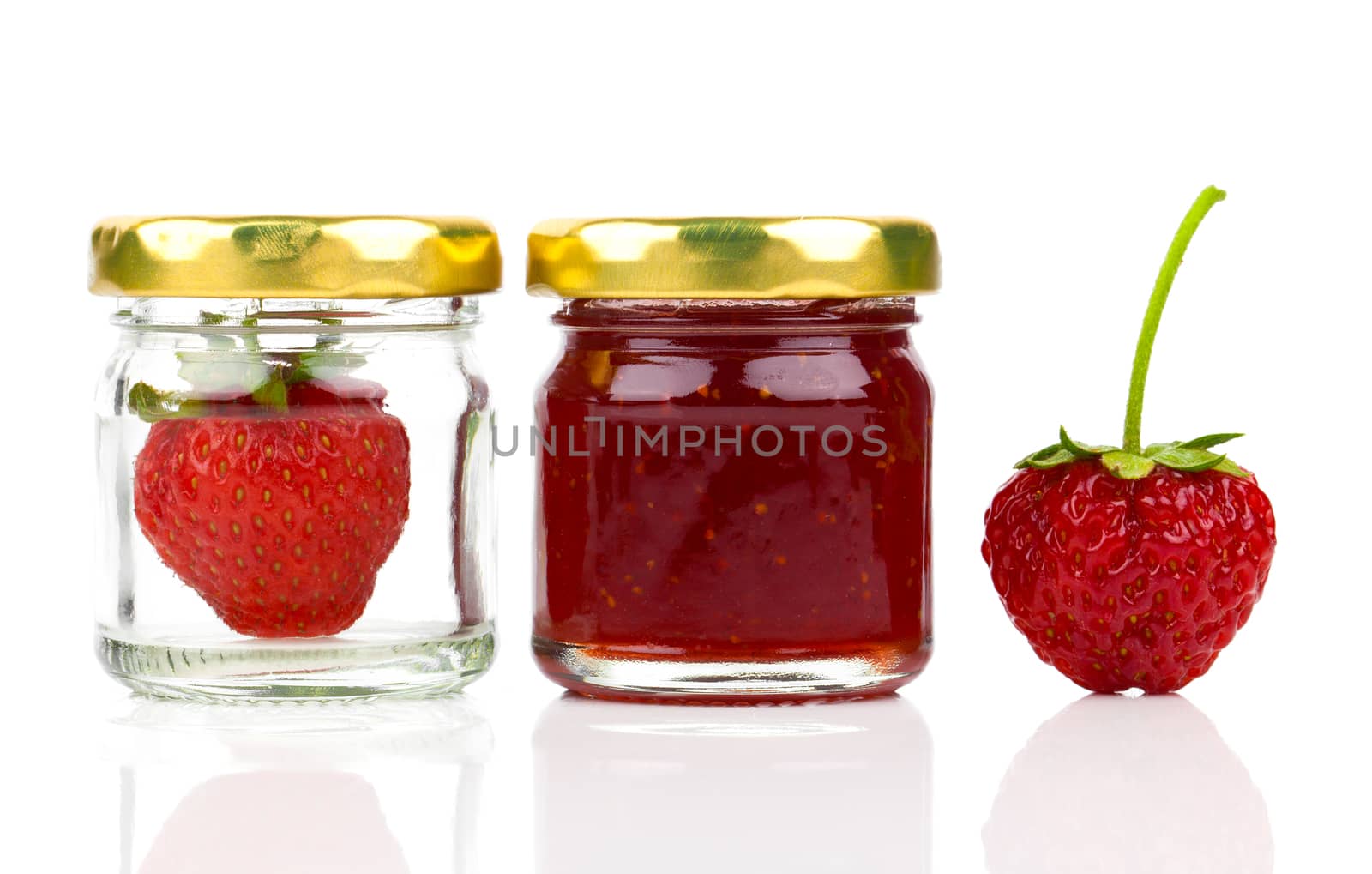 Strawberry jam and fresh berries isolated on white