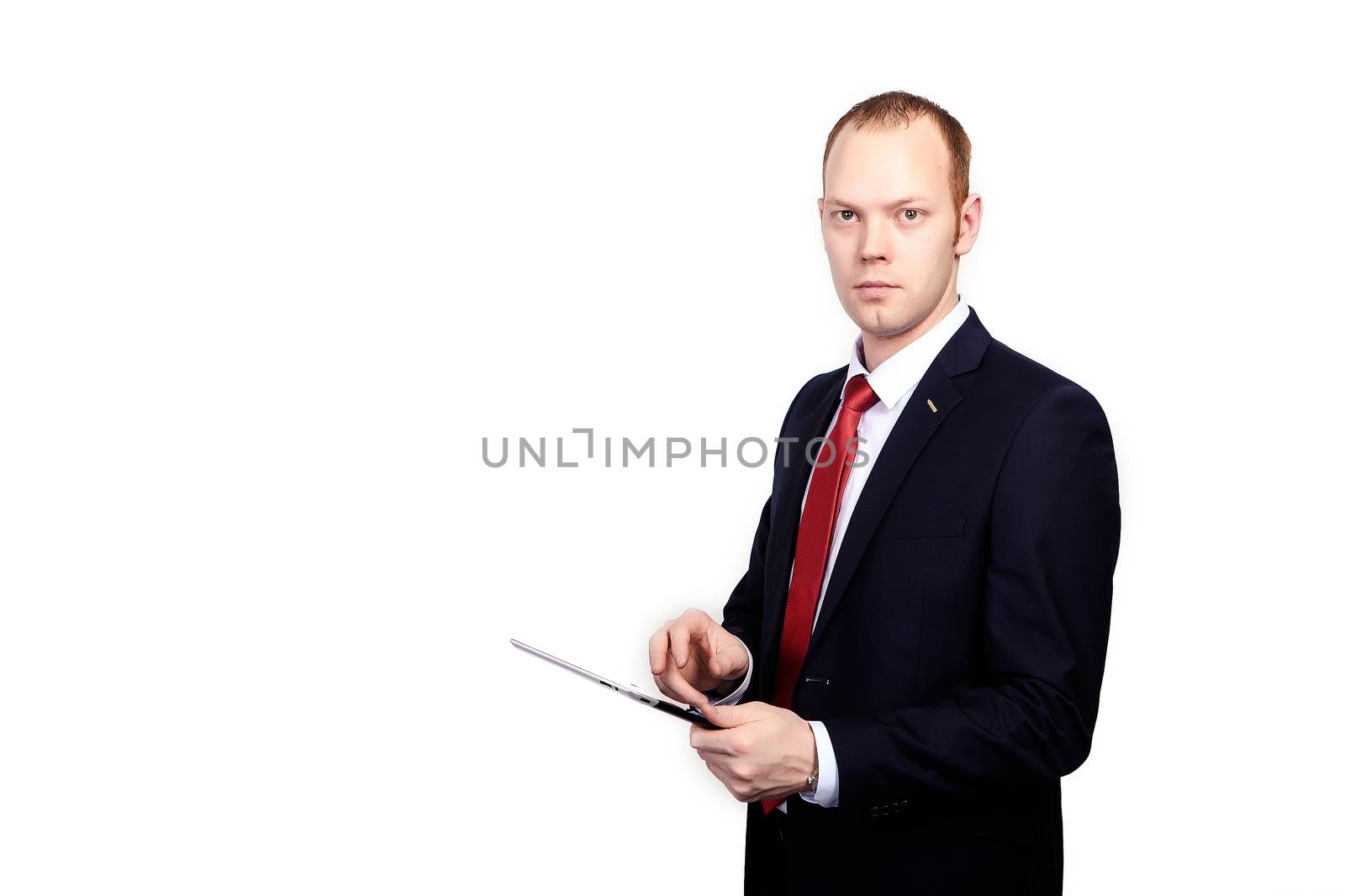 Successful manager of the company is working on a tablet computer on an isolated white background.