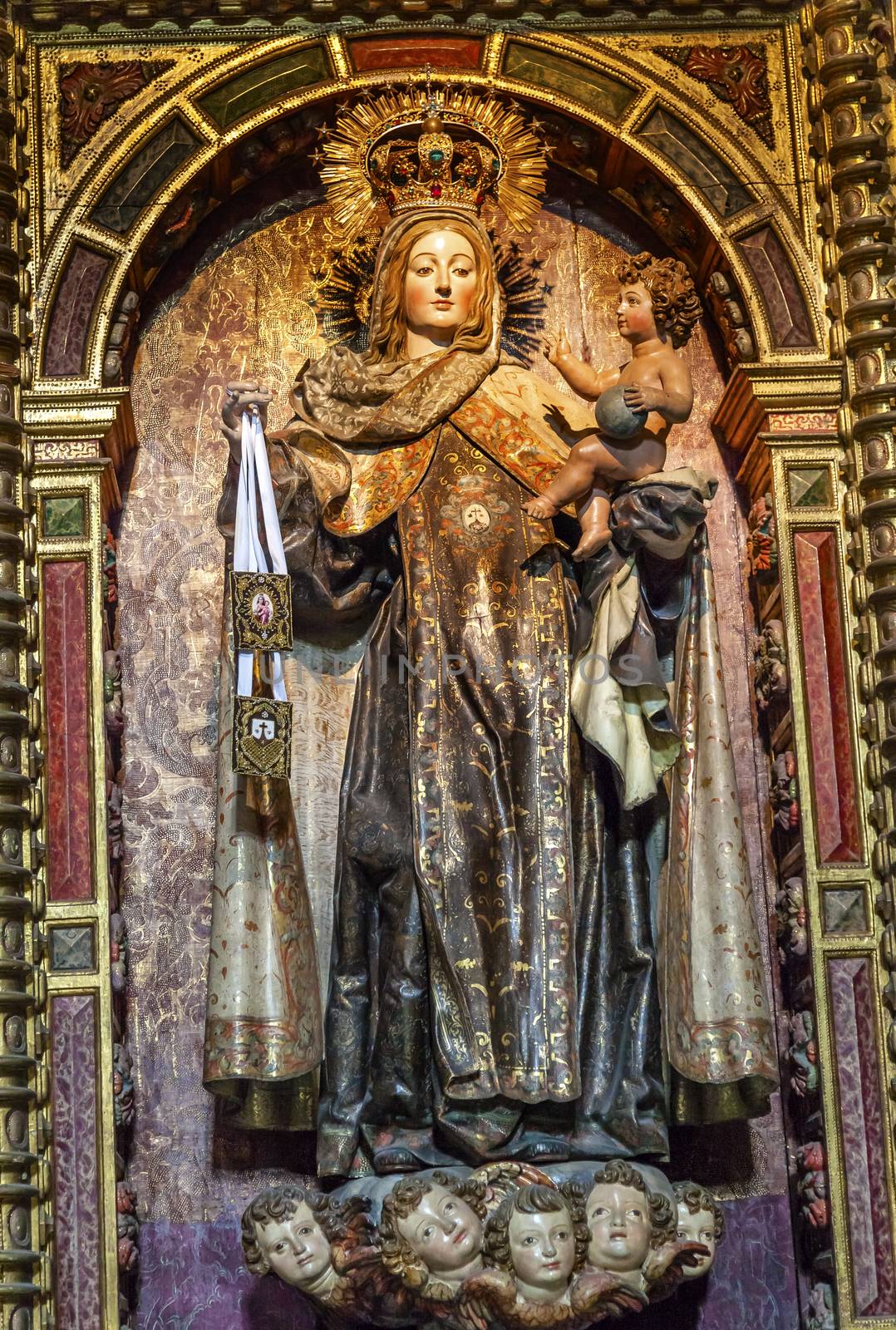 Virgin Mary Crown Jewels Baby Jesus Angels Wooden Statue San Juan Bautista Church Avila Castile Spain.  Parroquia de San Juan Bautista.  Gothic church built in the 1500s.  Avila is a an ancient walled medieval city in Spain.