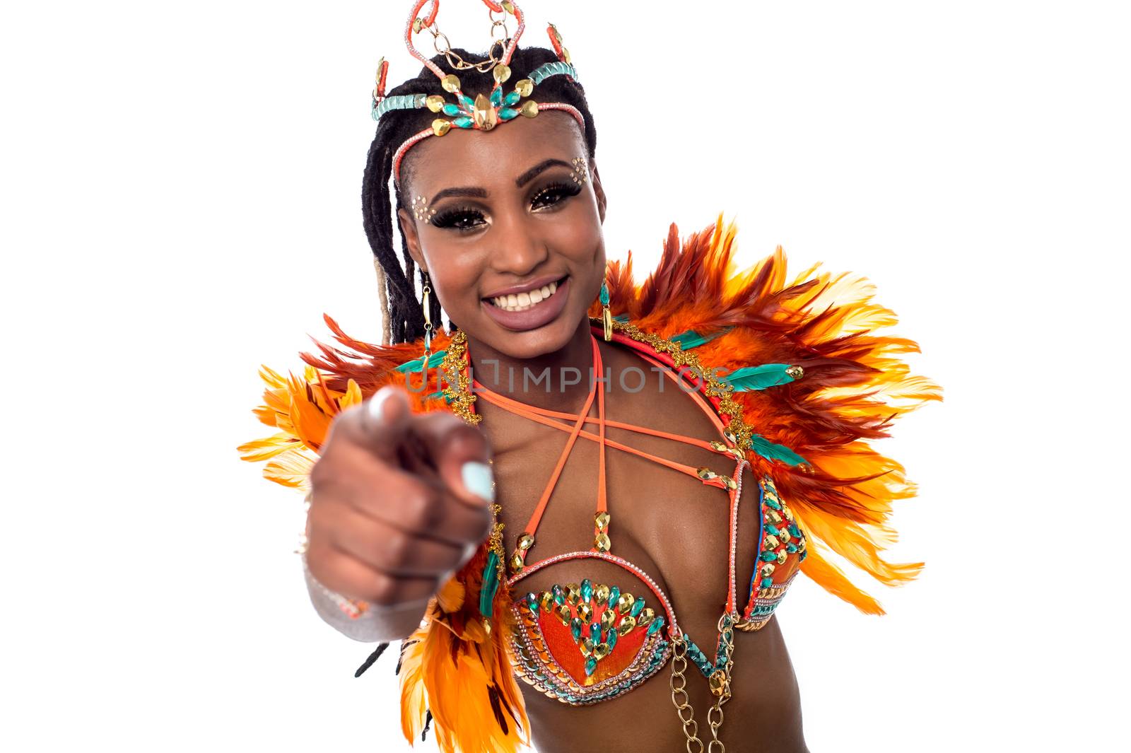 Smiling carnival costumed woman pointing