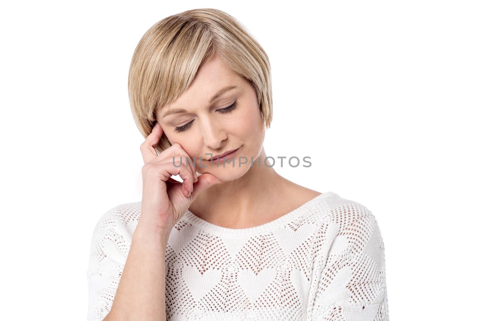 Thoughtful woman posing over white background