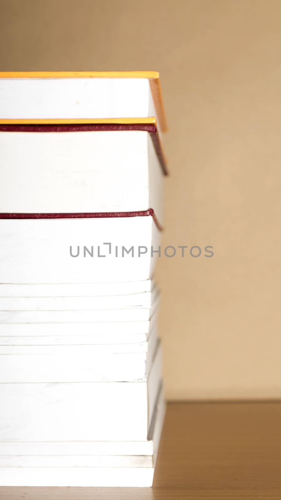 stack of book on wood table background