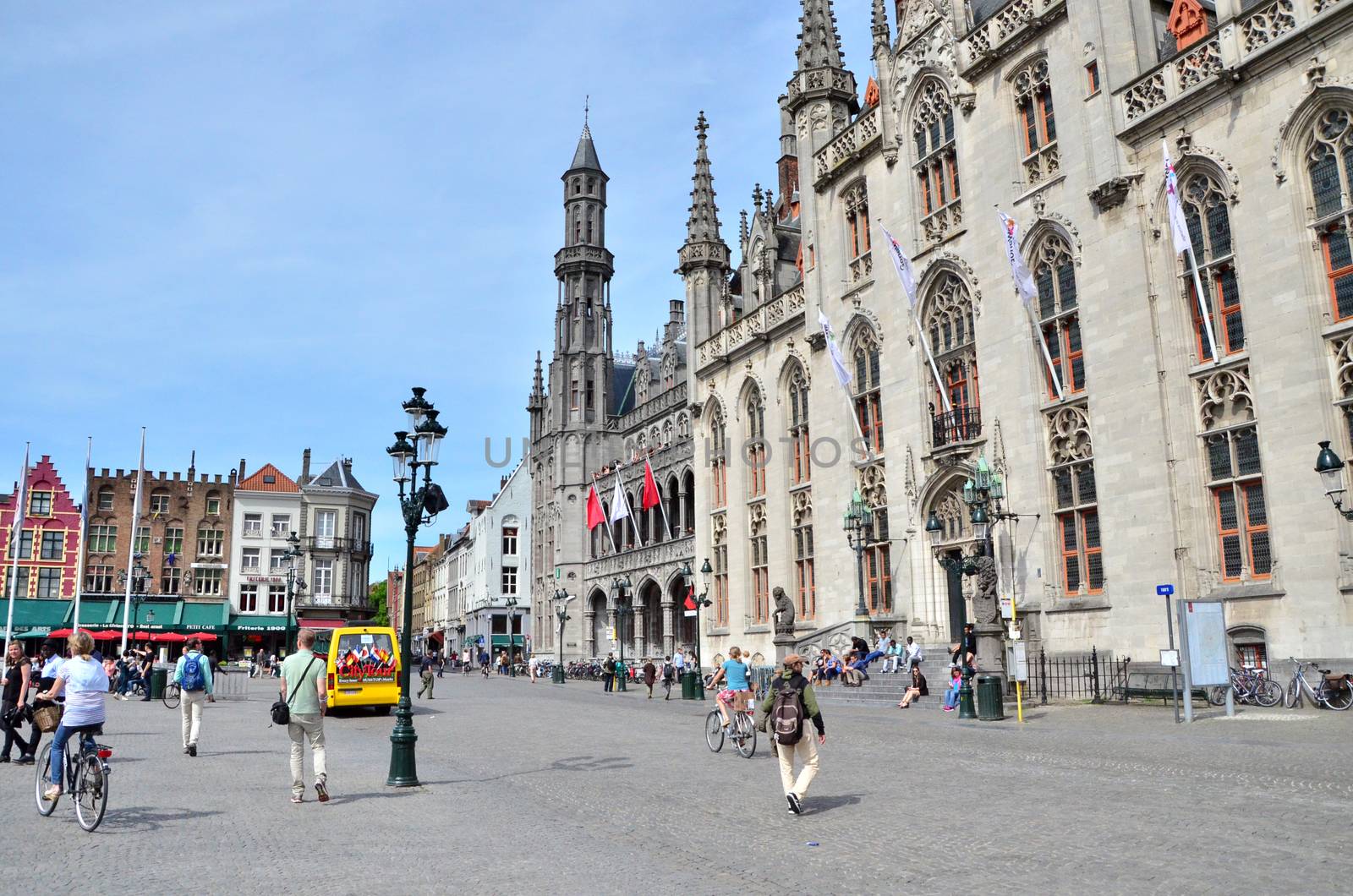 Bruges, Belgium - May 11, 2015: Tourist on Grote Markt square in Bruges, Belgium by siraanamwong