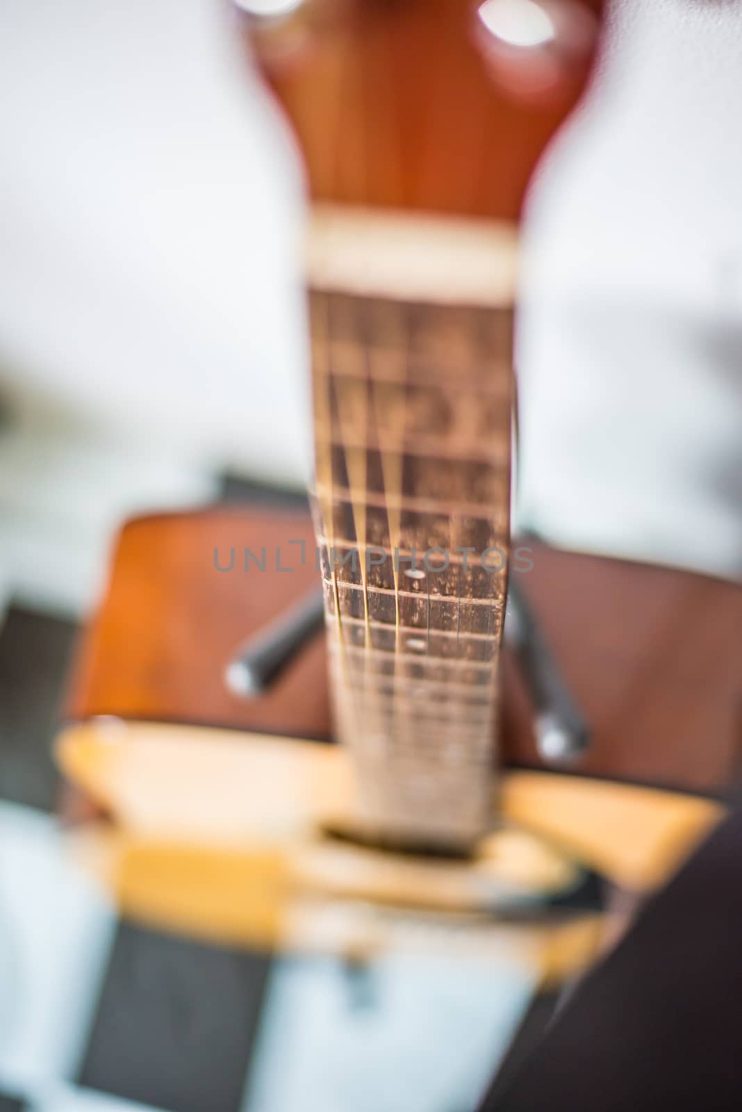 Focus on string classic wooden guitar.