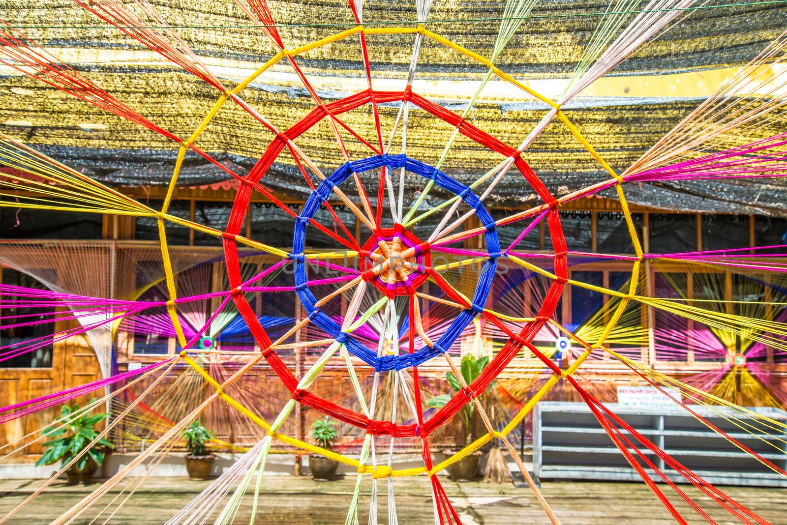 Thread colors to be made into a spider's web.