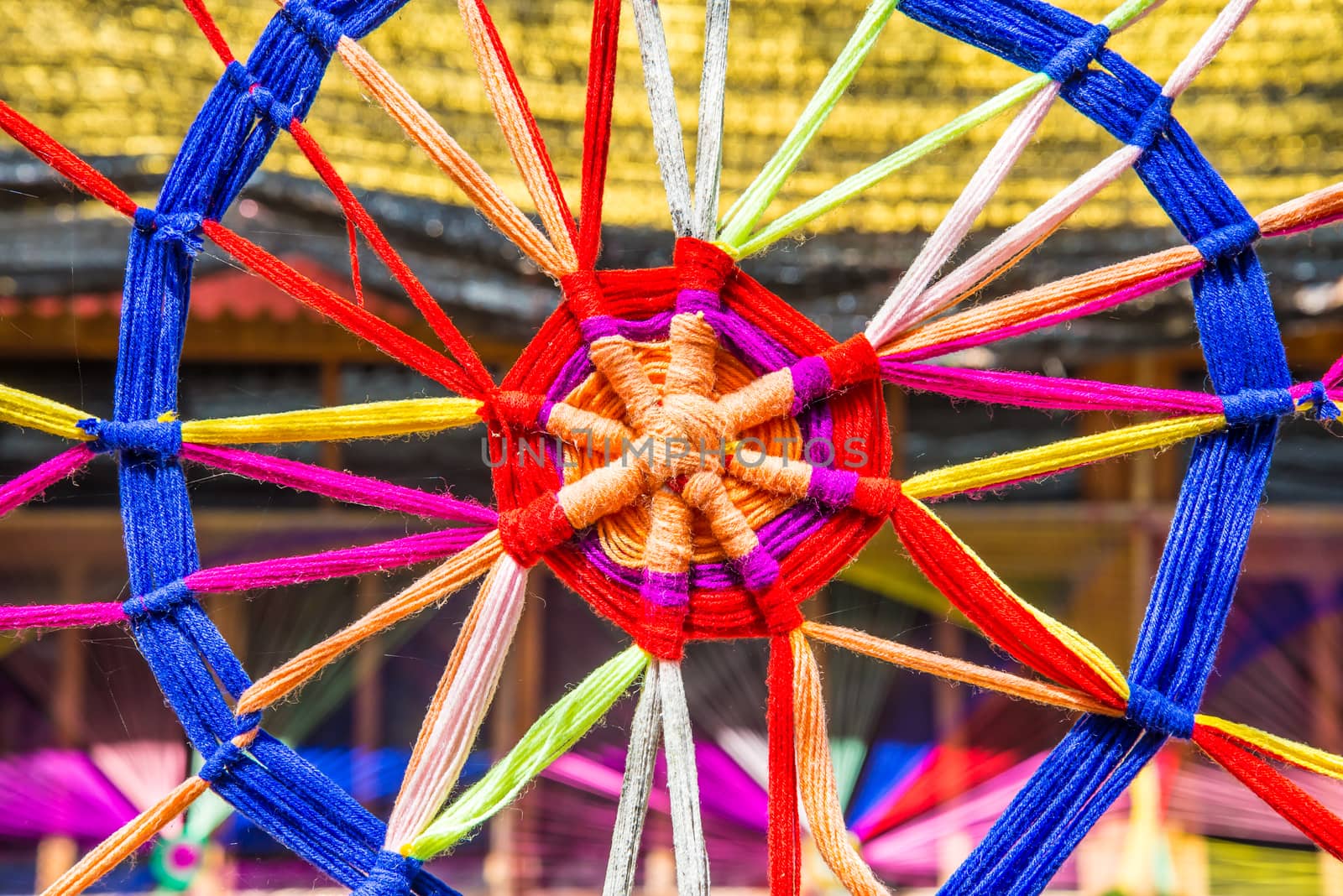 Thread colors to be made into a spider's web.