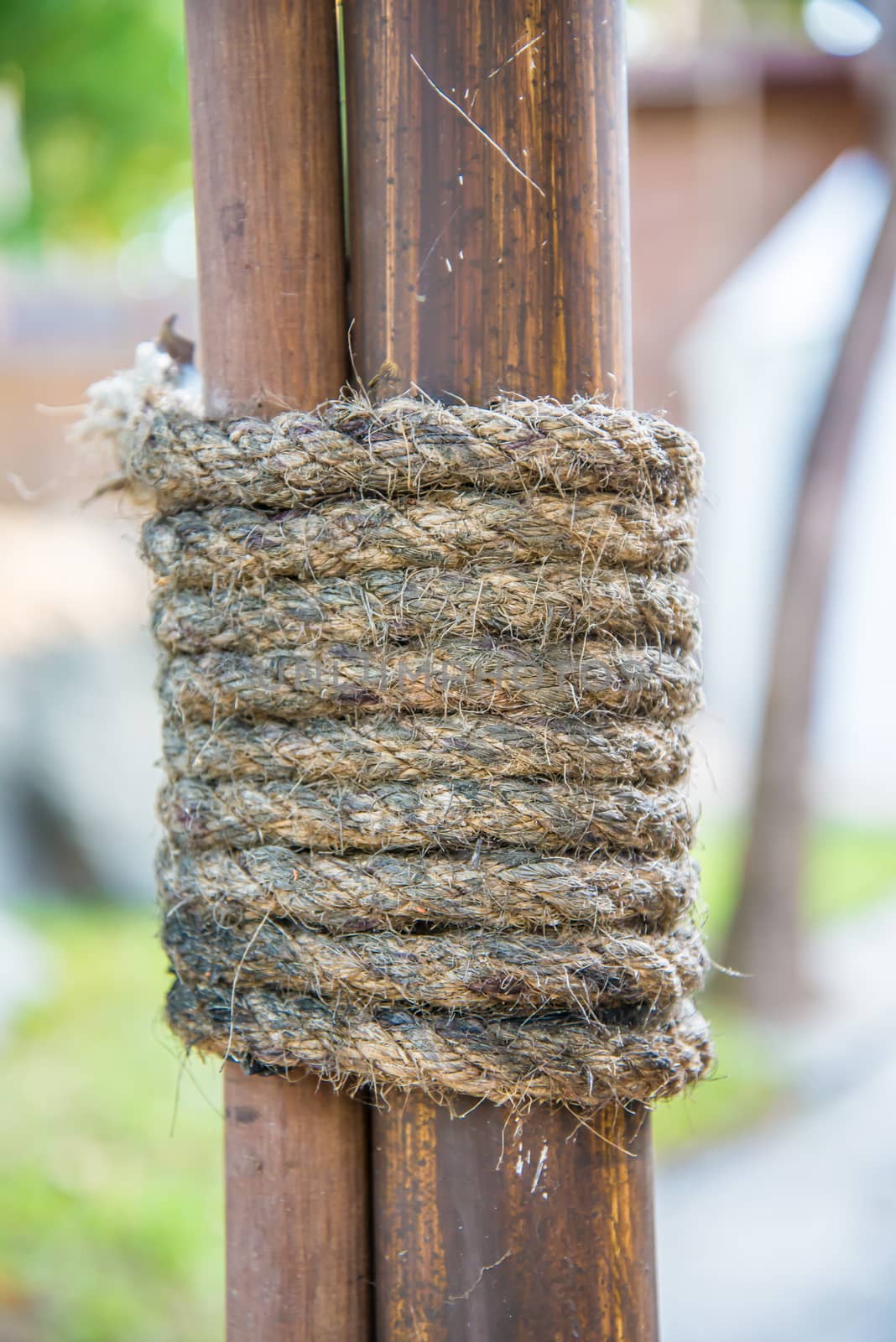 Hemp rope wrapped around the rods to seized the rods to the pole.