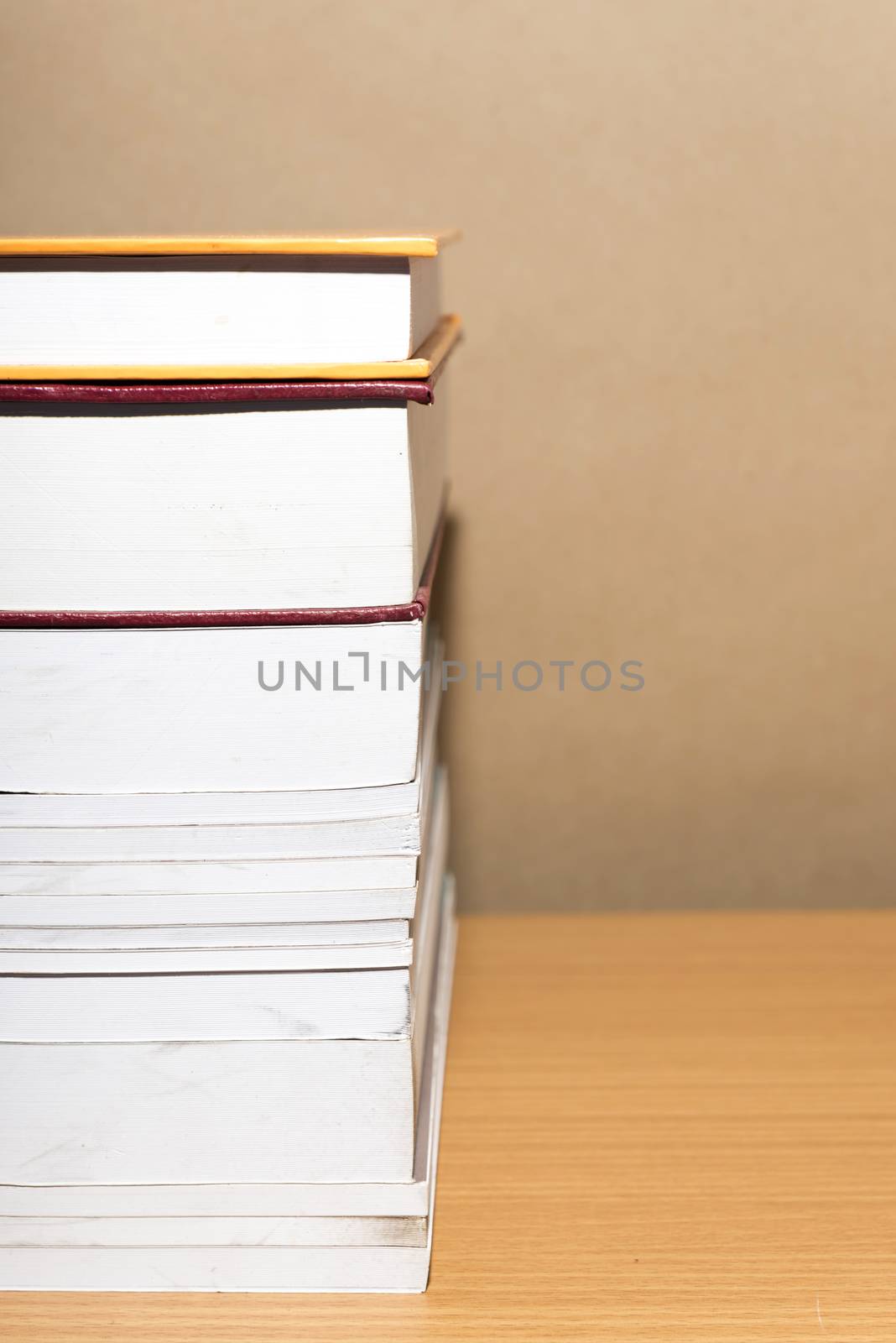 stack of book on wood table background