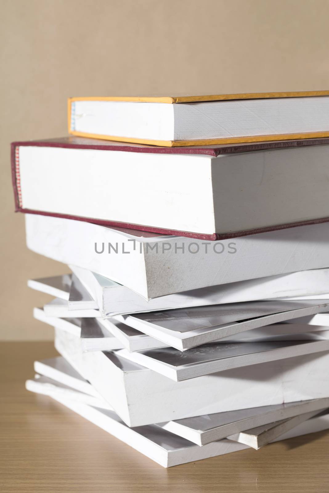 stack of book on wood table background