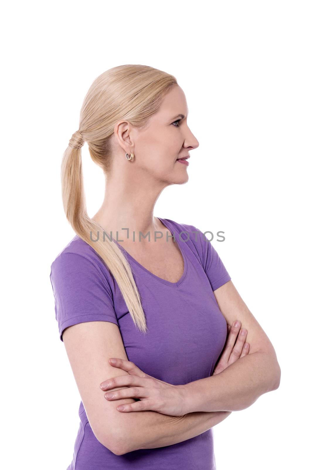 Side pose of smiling woman looking at something