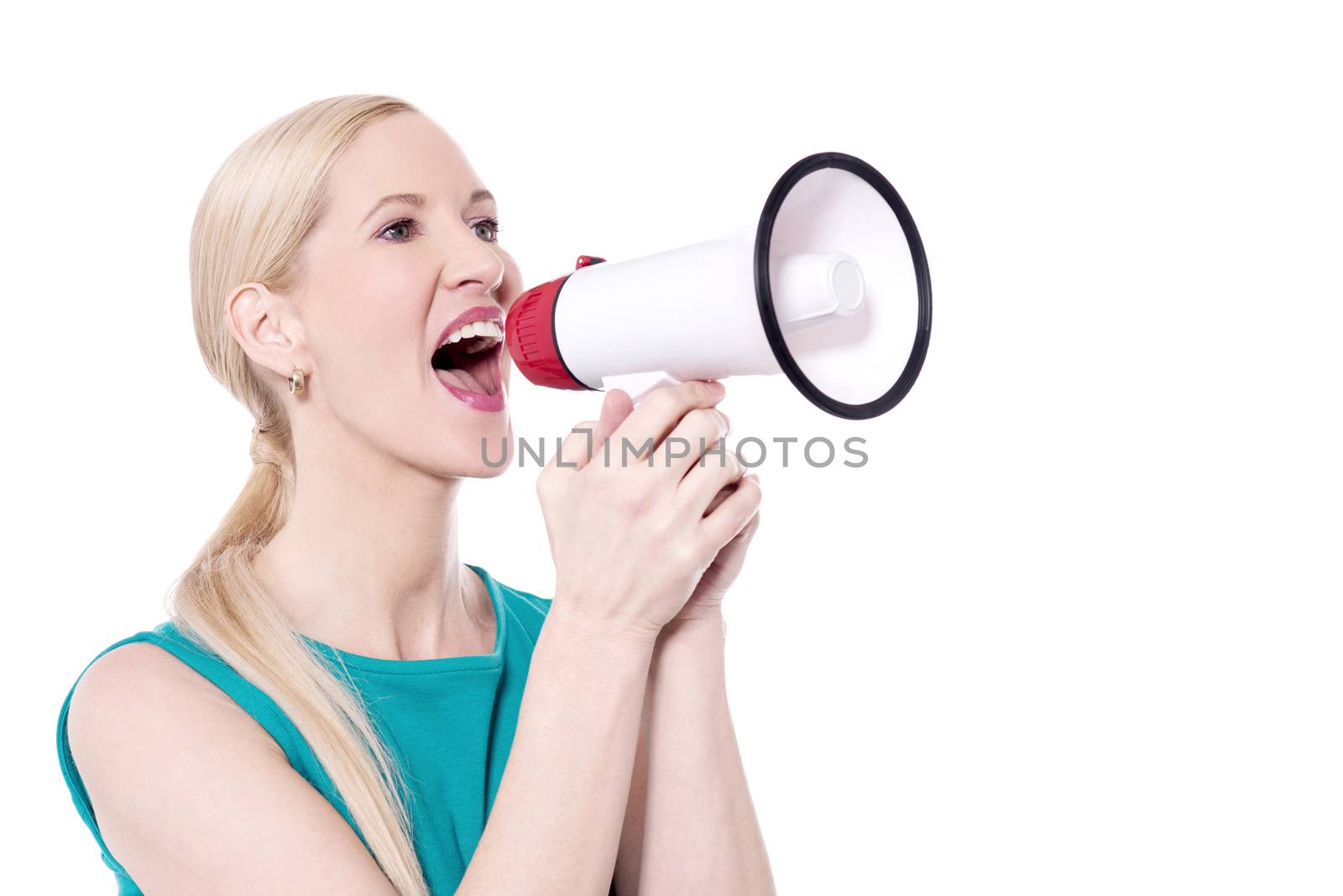 Portrait of a middle aged woman shouting through megaphone.