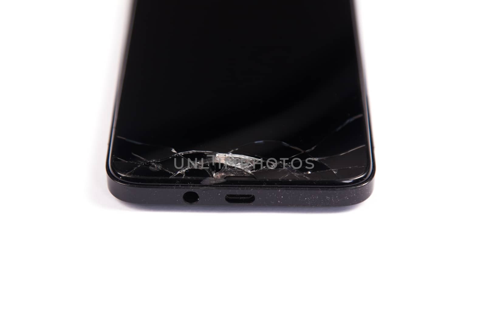 Broken screen mobile phone black isolated on a white background by traza