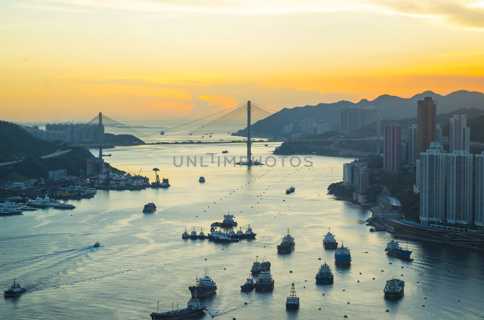 Hong Kong metropolitan downtown at sunset by kawing921