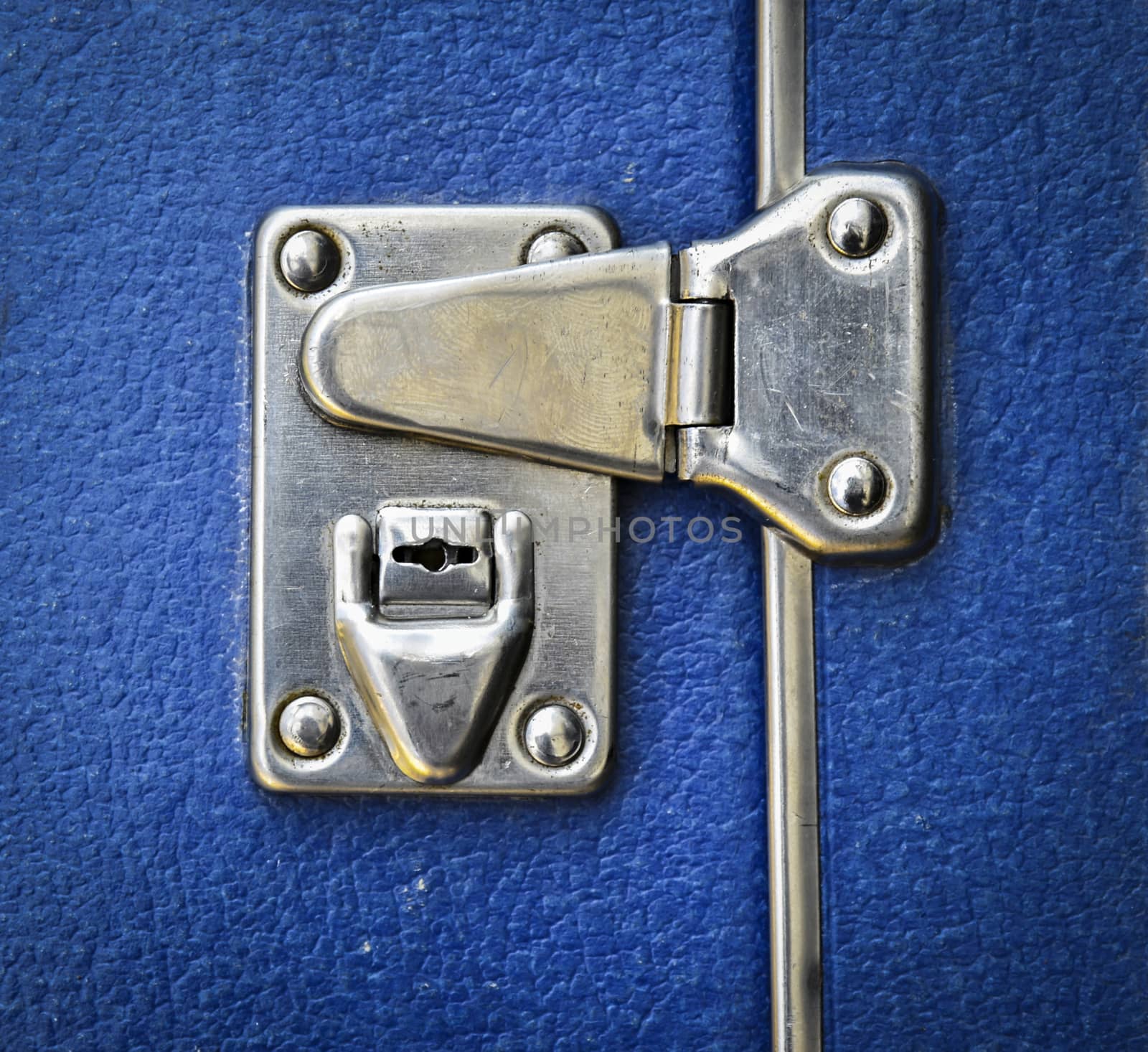 abstract background or texture metal lock on a blue suitcase