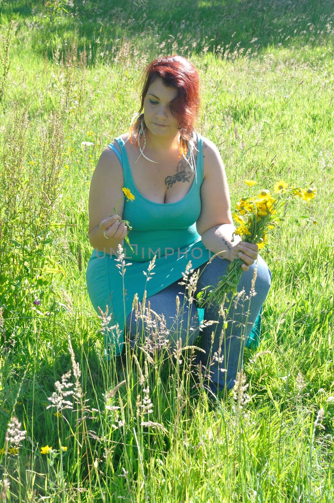 Woman in a meadow with flowers