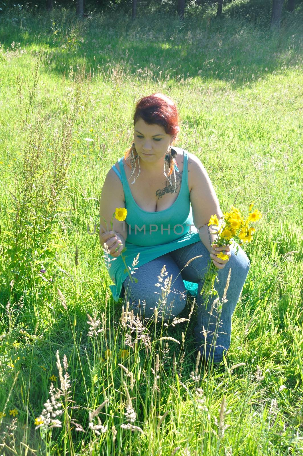 Woman in a meadow with flowers