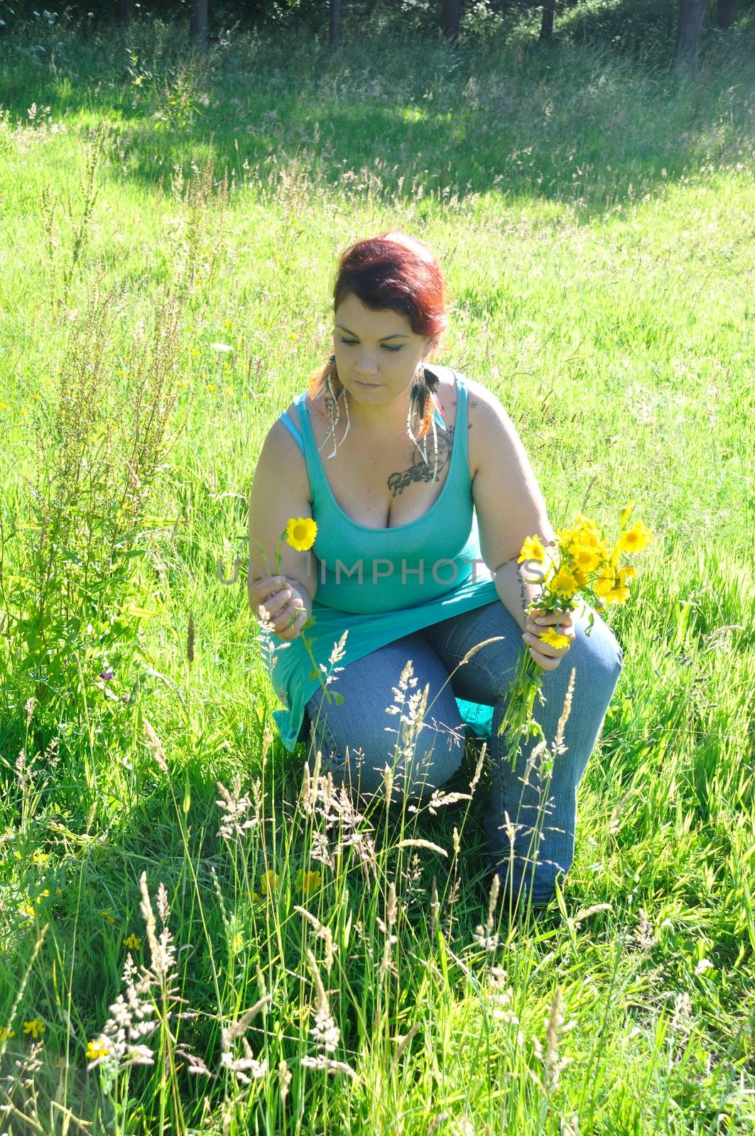 Woman in a meadow with flowers