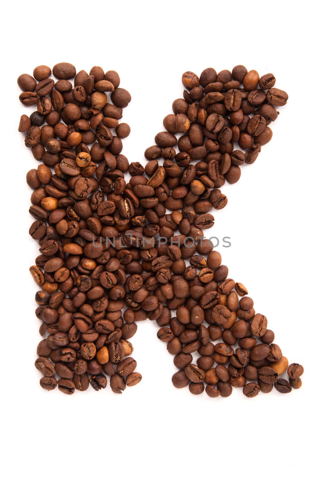 Alphabet letter I of roasted coffee beans isolated on white background by traza