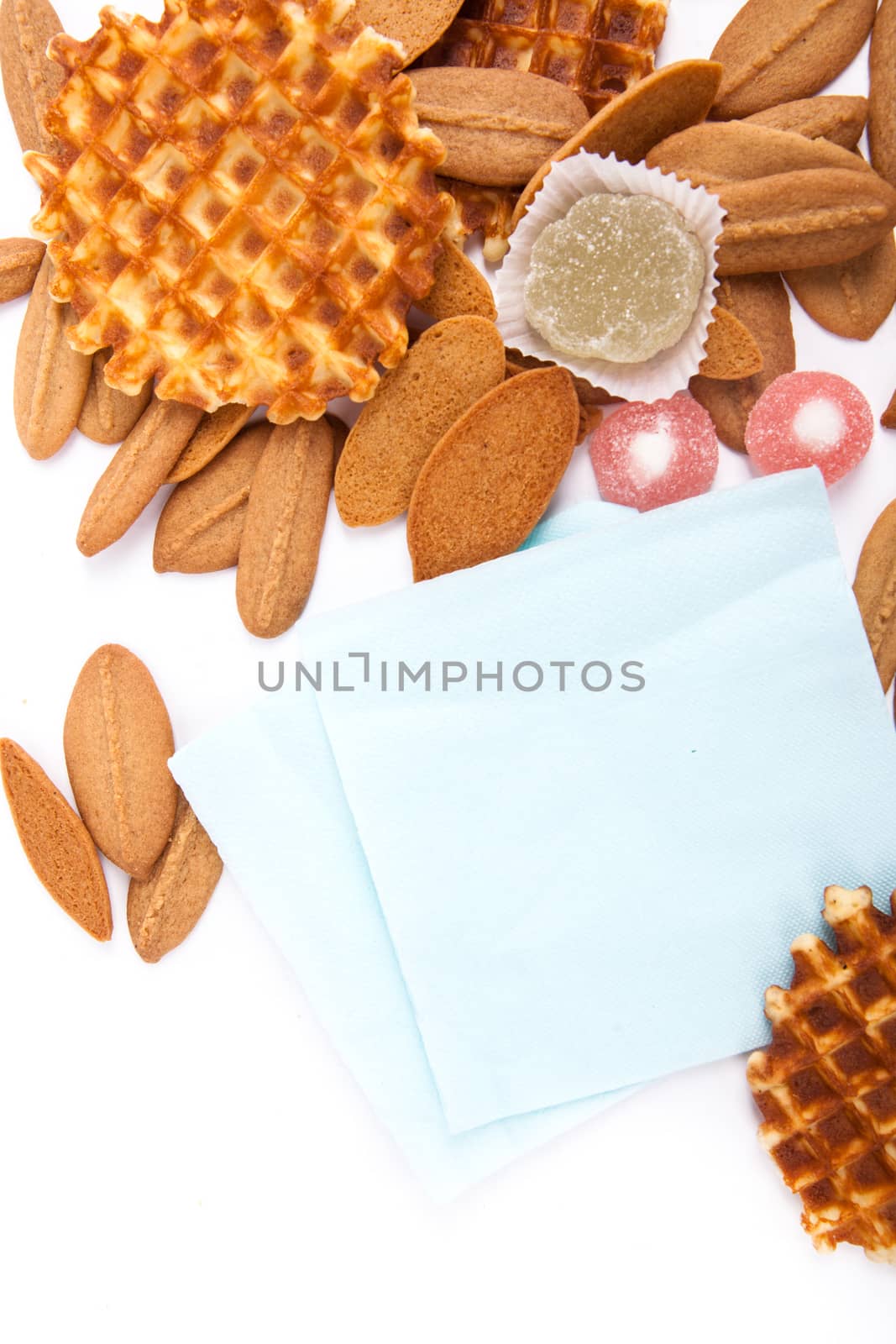 background biscuits, waffles, fruit jelly and fork and napkin isolated on white background
