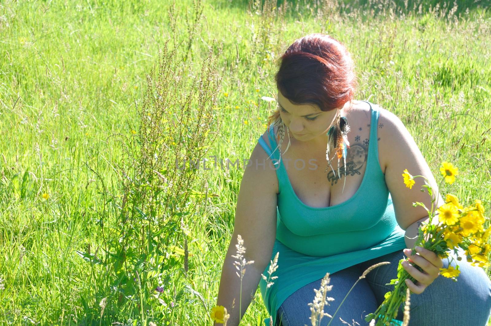 Woman in a meadow with flowers