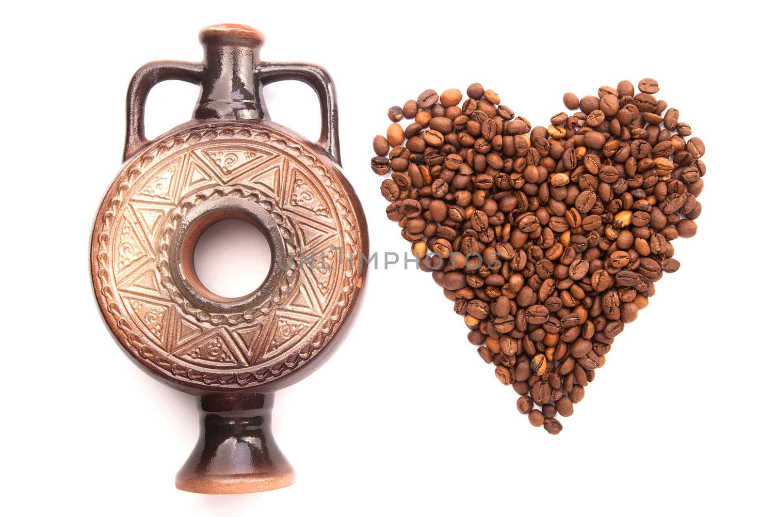bow tie patterned sea anchor lie on the circle of coffee beans isolated on white background