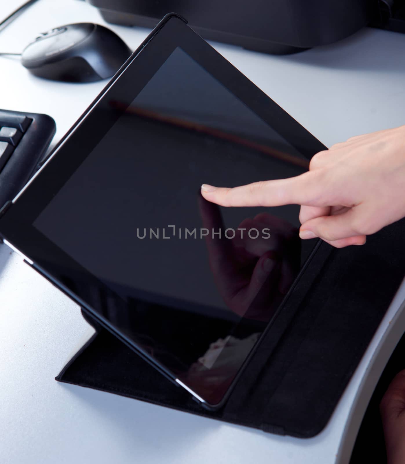 business woman in the workplace is working on a tablet