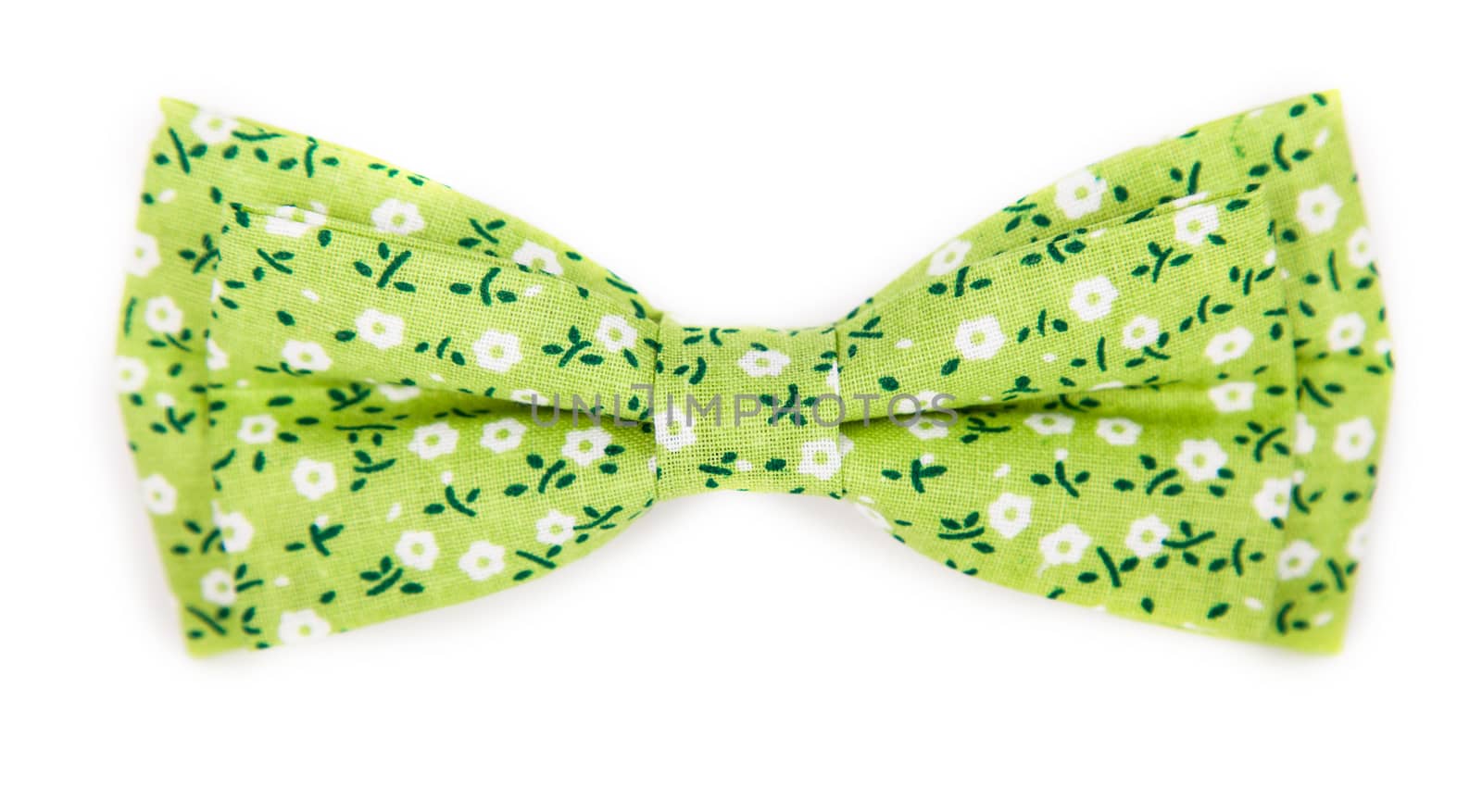 green bow tie with a pattern with summer flowers on an isolated white background