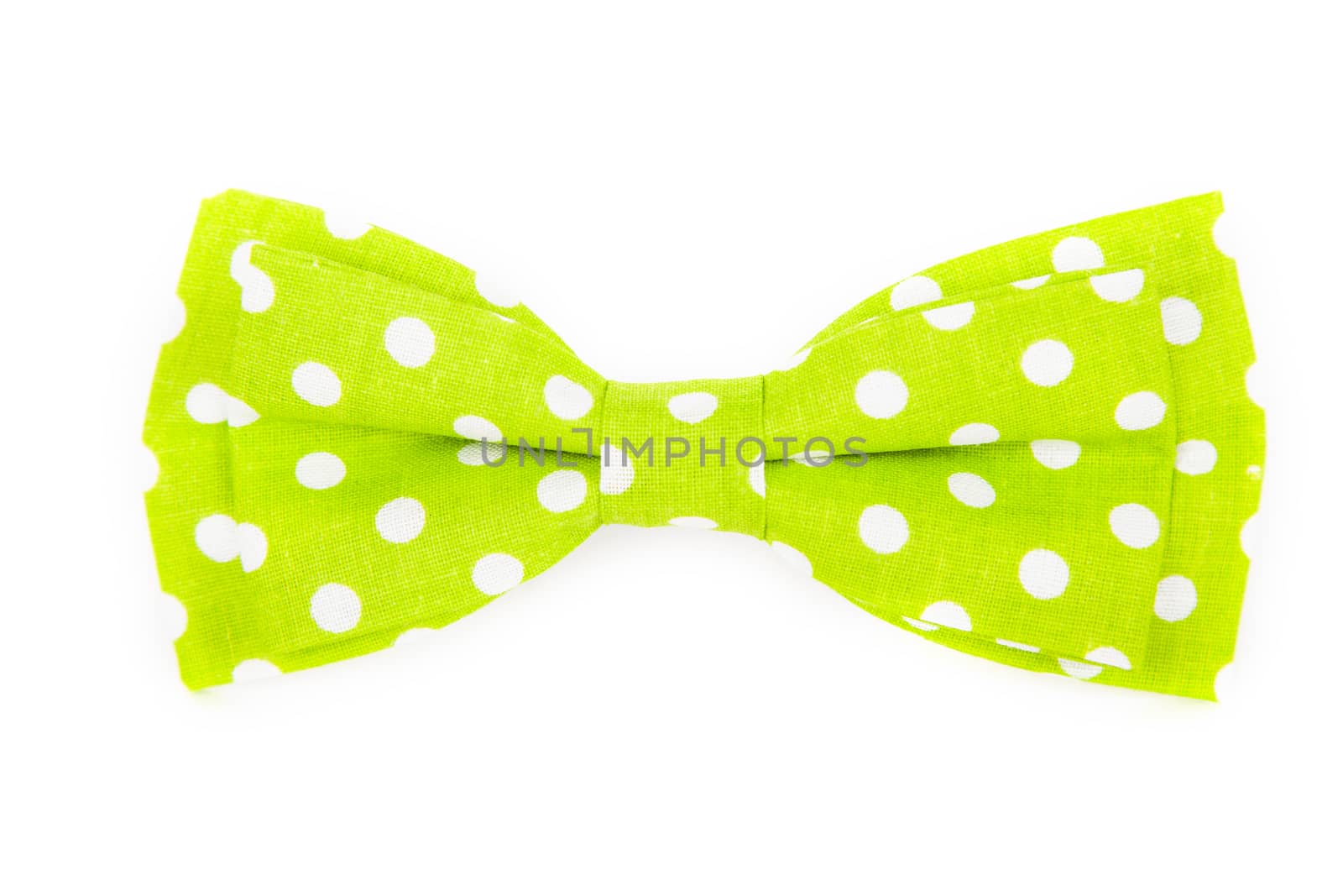 green bow tie with white polka dots on an isolated white background